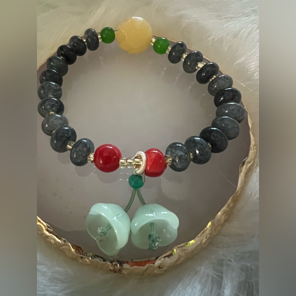 Beaded Bracelet with Green Tulip Charm and Red Accent Beads